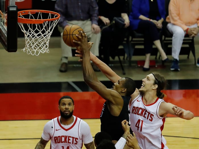May 14, 2021; Houston, Texas, USA; LA Clippers center Serge Ibaka (9) drives to the basket as Houston Rockets forward Kelly Olynyk (41) defends during the first quarter at Toyota Center. Mandatory Credit: Bob Levey/Pool Photo-USA TODAY Sports